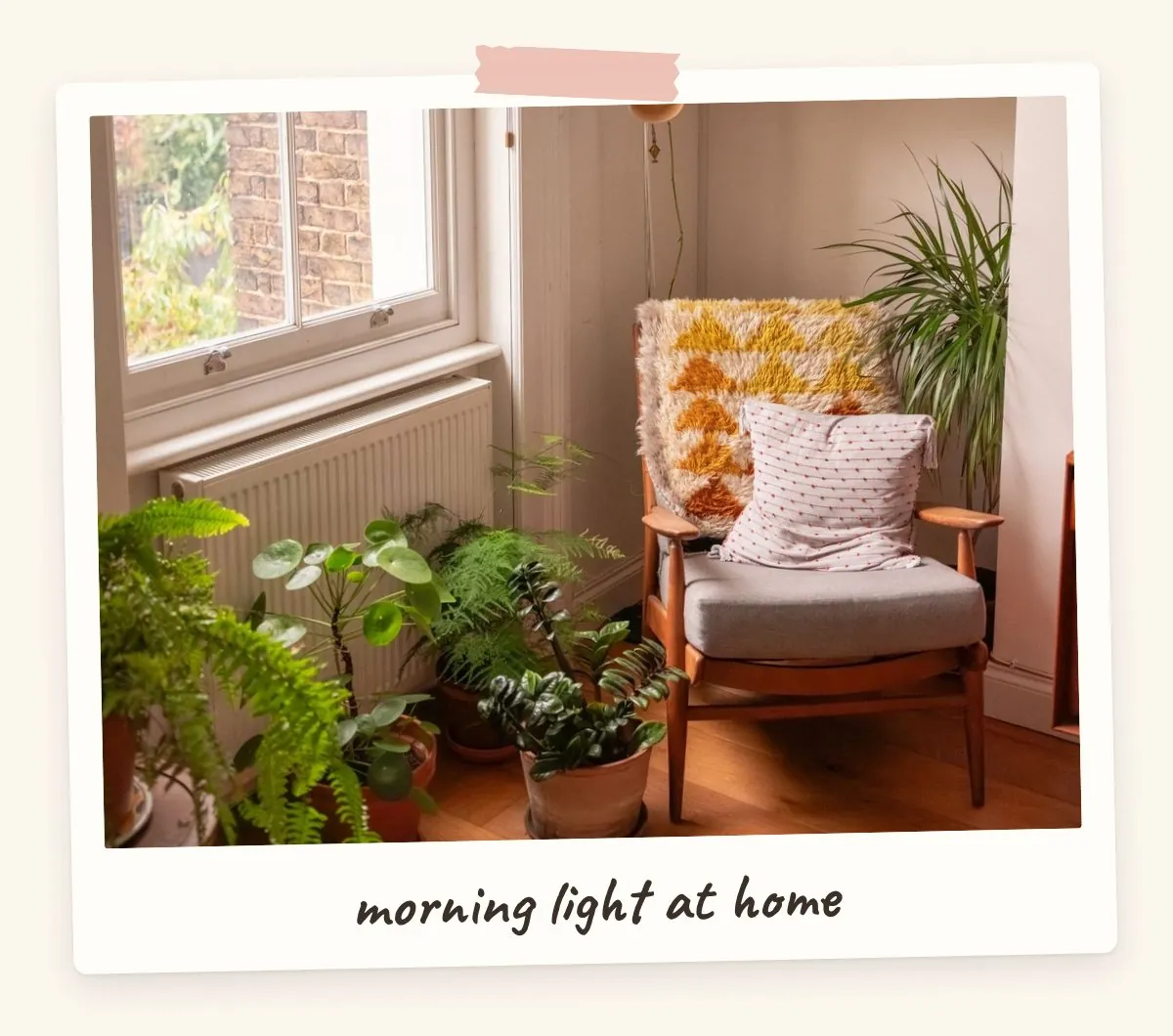 Sunlit reading nook with armchair, yellow cushion and houseplants for a dream home vision board