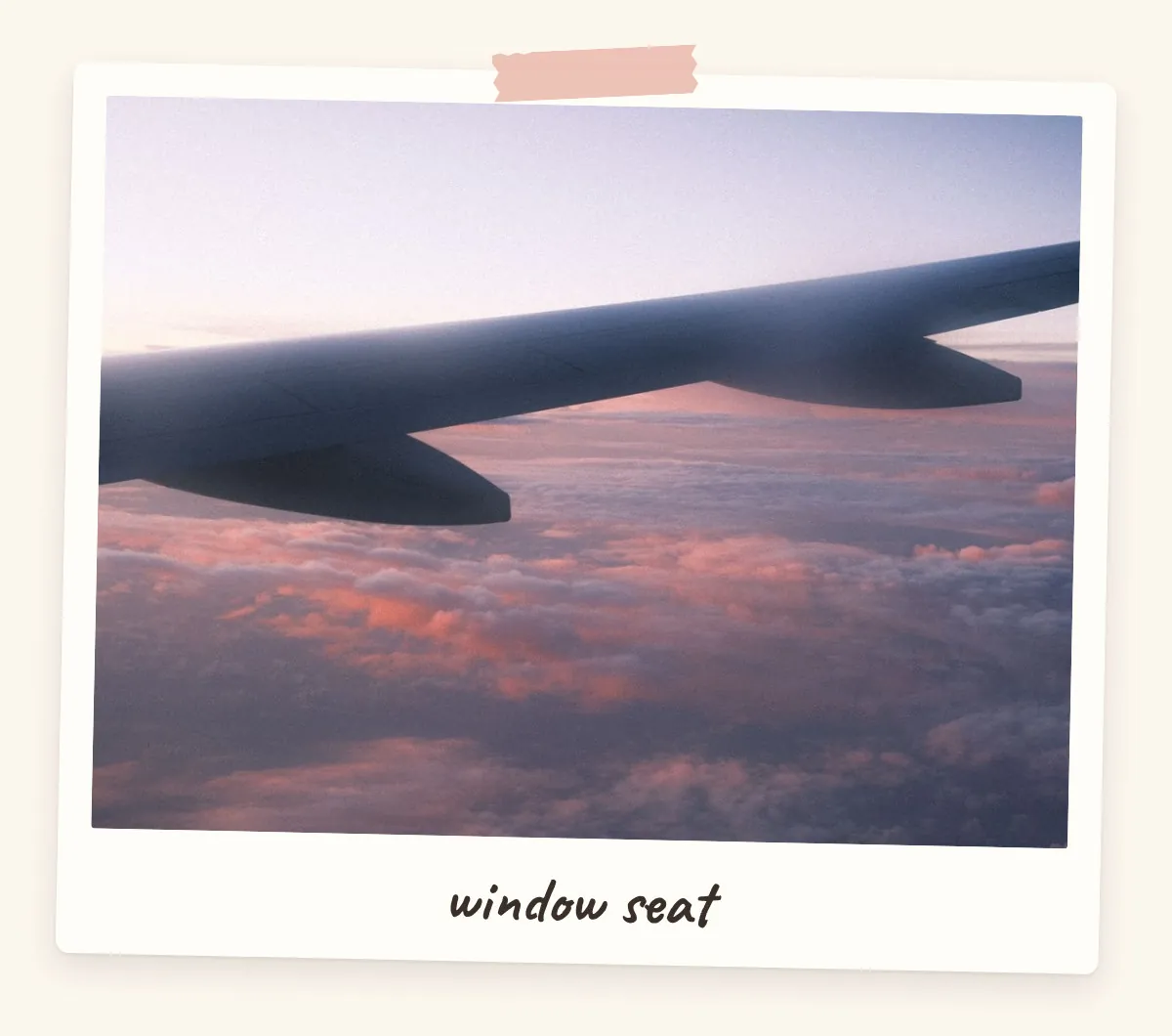 Airplane window view of the wing over pink sunset clouds for a travel vision board
